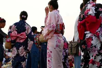 Rear view of people in traditional clothing