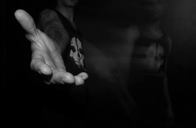 Blurred motion of man stretching hand