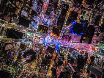 Overhead shot of buildings and streets around times square. advertisements and displays glowing ligh