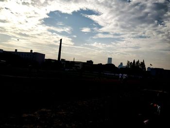 City against sky at sunset