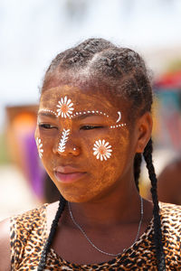 Close-up portrait of a serious young woman