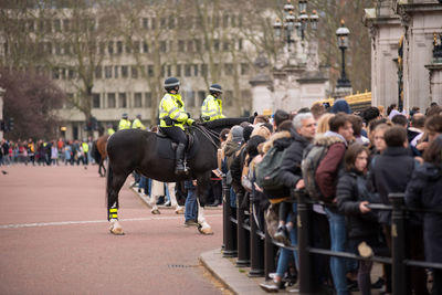 Crowd of tourists watching the changing the guards military parade 