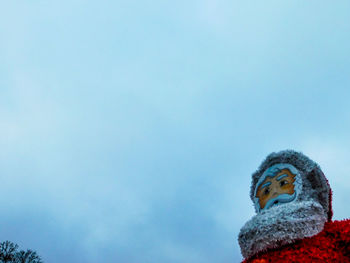 Low angle view of statue against blue sky