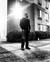 Man standing in front of building