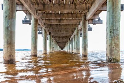 Low angle view of pier in lake