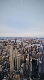 Aerial view of cityscape against sky