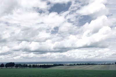 Scenic view of agricultural field against sky