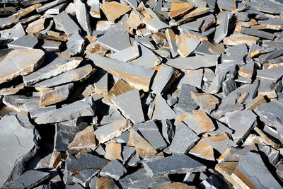 Full frame shot of stone material at construction site during sunny day