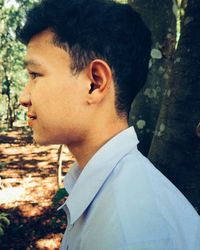 Side view portrait of young man looking away