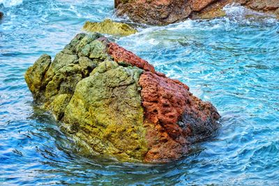 High angle view of rock in sea