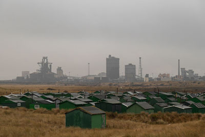 Buildings in city against sky