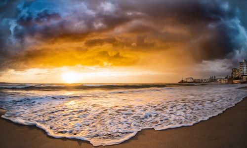 Scenic view of sea against cloudy sky