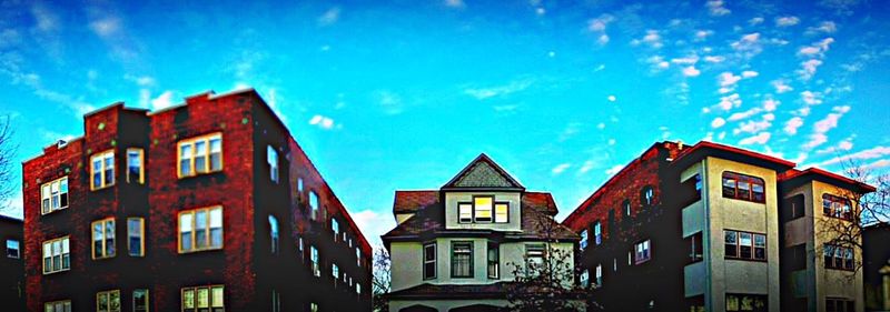 Low angle view of building against blue sky