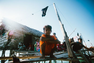 People at traditional clothing against clear sky