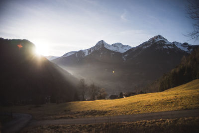 Scenic view of snowcapped mountains against sky