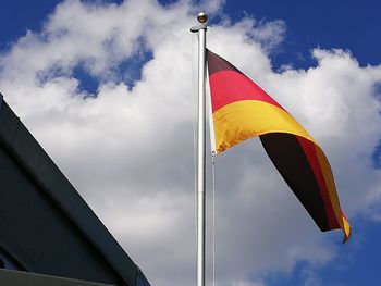 Low angle view of flag against sky