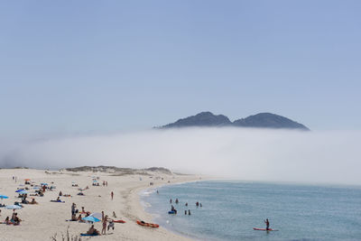 Scenic view of beach against clear sky