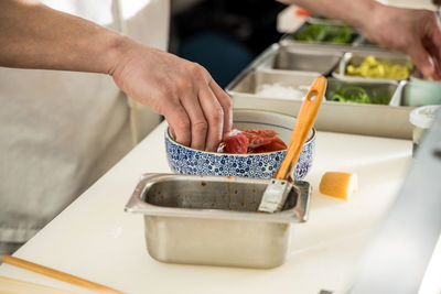 Midsection of person preparing food