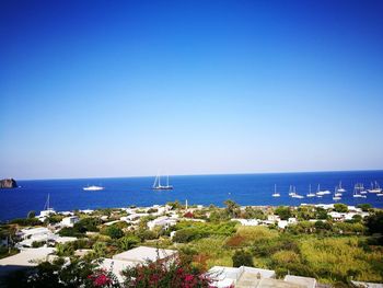 Scenic view of sea against clear blue sky
