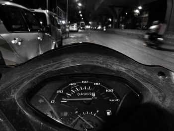 View of car windshield on street at night