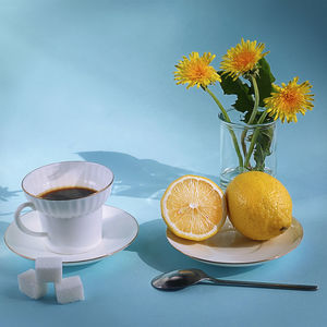 Yellow and white flowers in vase on table