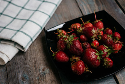 High angle view of strawberries on table