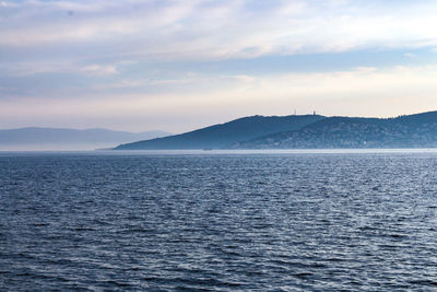 Scenic view of island and sea against sky