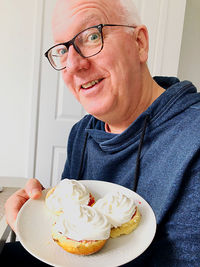 Portrait of smiling man with ice cream
