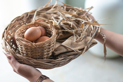 Close-up of person holding ice cream in basket