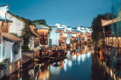 Canal passing through city buildings