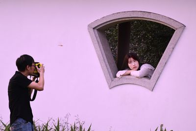 Full length of a girl photographing