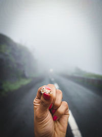 Close-up of woman holding hands