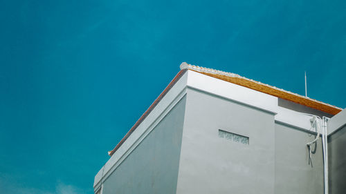 Low angle view of building against blue sky