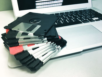 Close-up of hard drives on laptop at table