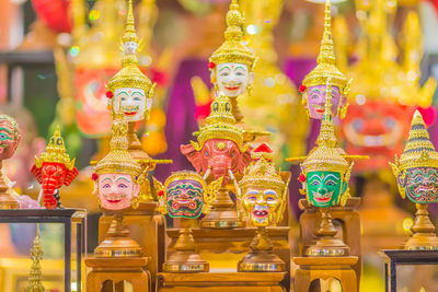 Close-up of buddha statue against temple