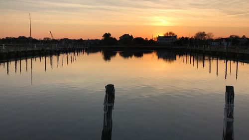 Scenic view of lake against sky during sunset