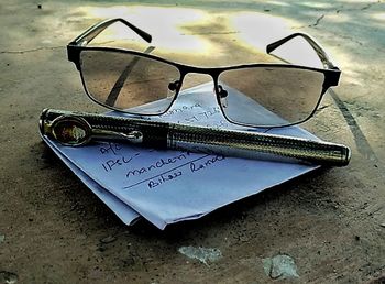 Close-up of eyeglasses on wall