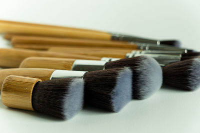 Close-up of make-up brush on white background