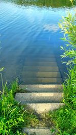 High angle view of steps by lake
