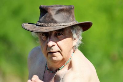 Portrait of senior man wearing hat