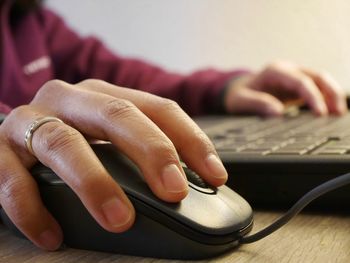 Close-up of man working on table