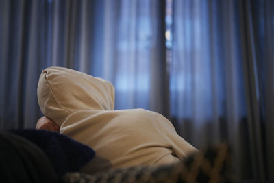 Man resting on sofa