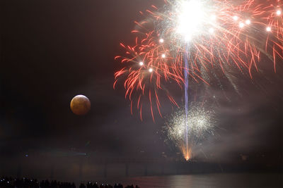 Firework display at night