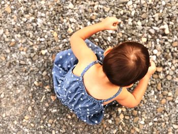 High angle view of woman on pebbles