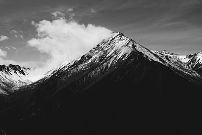 Scenic view of snow covered mountains against sky