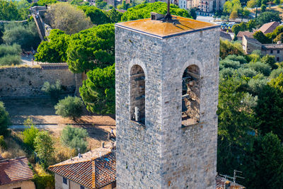 Tower bell seen from the top of the main tower, city of san gimignano, tuscany