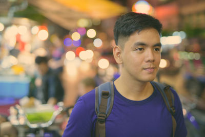 Portrait of young man standing outdoors