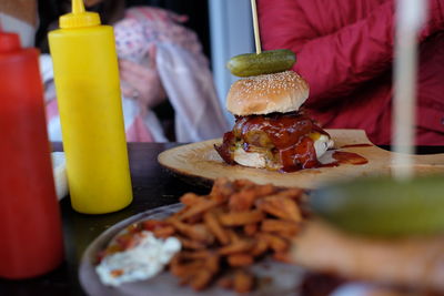 Burger on serving tray at table