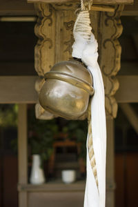 Close-up of sculpture hanging against wall in building
