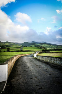 Empty road against sky